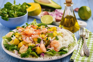 Salad with shrimps, mango, avocado and rice noodles.