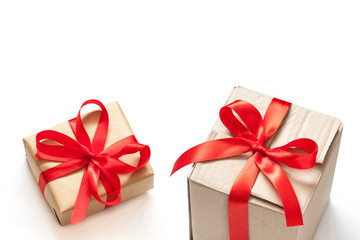 Gift boxes, tied with red ribbons. Festive packaging wallpaper. 