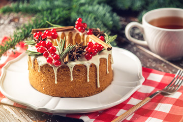 Homemade Christmas or New Year holiday berry cake decorated currants and rosemary. Concept of festive desserts