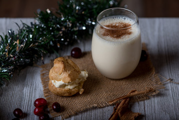 Glass of egg nog garnished with cinnamon