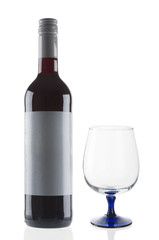 Red wine bottle and goblet on white background