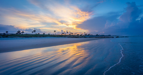 Fototapeta premium A reflection on the beach at sunset