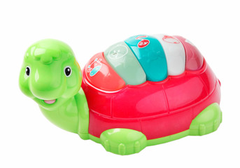 Colorful plastic turtle toy isolated.
