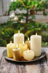 Fototapeta na wymiar Candles on wooden table.