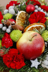 Floral arrangement with carnations, chrysanthemum santini flowers and fir.