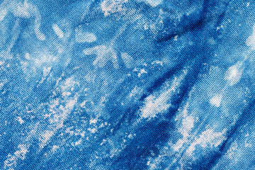 The fabric indigo tie dye as a background and texture.