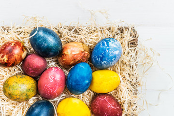 Fototapeta na wymiar Bright Easter Eggs dyed using natural ingredients