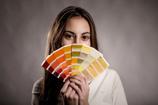 Young Woman Holding A Pantone Palette