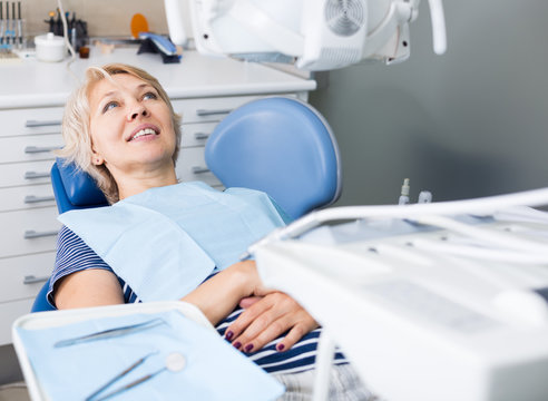 Woman in dentist office waiting for procedure