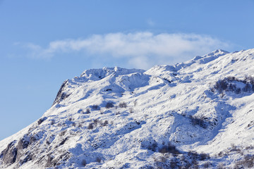 Snowy landscape background with mountains and trees