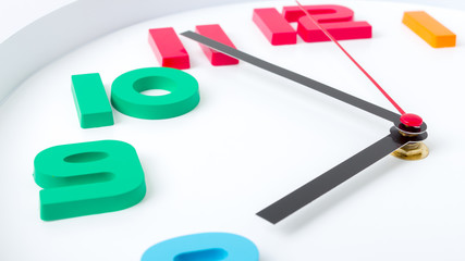 Colorful clock or time abstract background. white clock with red and black needles