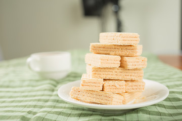 Wafer biscuits served with tea.