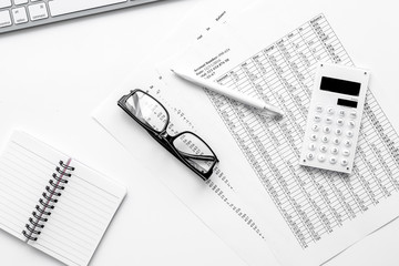 accounting work space with calculator, profit and tables on whit