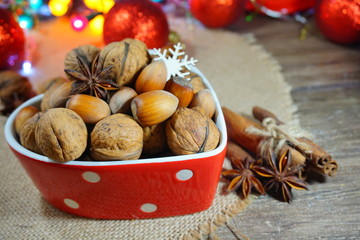 Nuts and spices.Christmas time. At the holiday table.Still life, food and drink, seasonal and holidays concept

