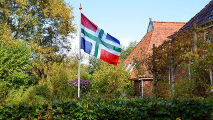Flag of the province of Groningen in peasant garden