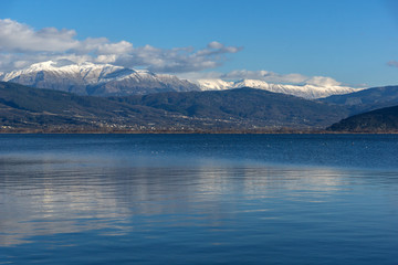 Fototapeta na wymiar Amazing panoramic Landscape of Lake Pamvotida, Pindus mountain and city of Ioannina, Epirus, Greece