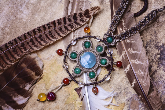 Natural gemstone handmade macrame meterial necklace with wild feather background