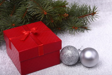 Christmas gifts. Christmas decoration with presents and red ball with fir branches