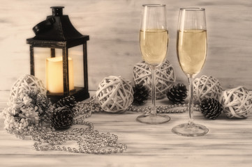  Champagne glasses on white background with decorations, lantern, festive evening, new year and christmas, winter fairy tale, romantic evening