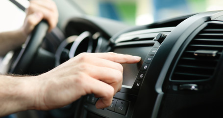 Man Using Gps Navigation System In Car to travel