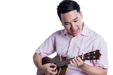 asian man play ukulele with happiness on white background