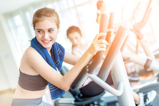 CAUCASIAN sport woman enjoy workout with treadmill in gym fitness center with group of people
