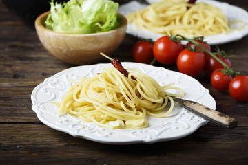 Italian pasta spaghetti with oil, garlic and chili, selective focus