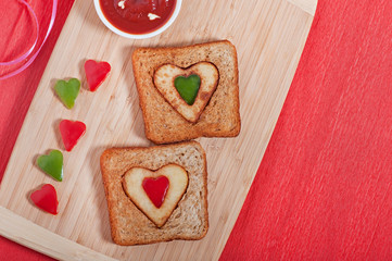 French fries and fresh vegetables chopped in the shape of a heart. Valentine's Day