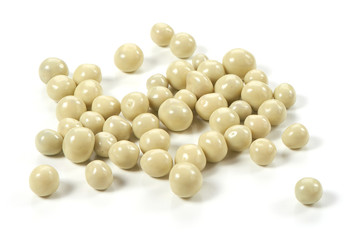 Dried berries in a white chocolate, close-up, isolated on white background.
