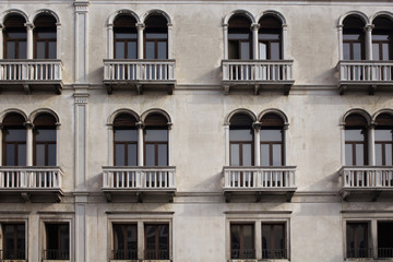View of a facade of old, historical building in Venice. The image reflects architectural style of region.