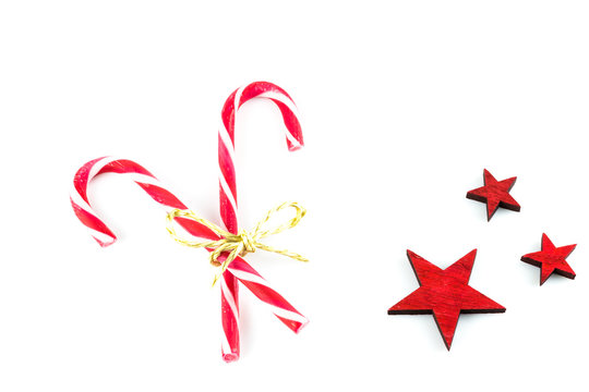 Red White Striped Candy Canes, Red Stars Beside, White Background