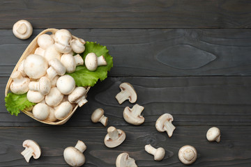 mushrooms on dark wooden background. top view with copy space