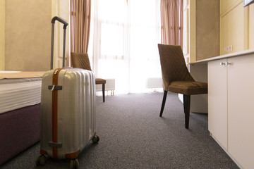 Suitcase or luggage bag in a modern hotel room