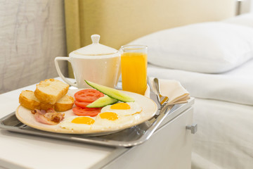 Breakfast in bed in hotel room