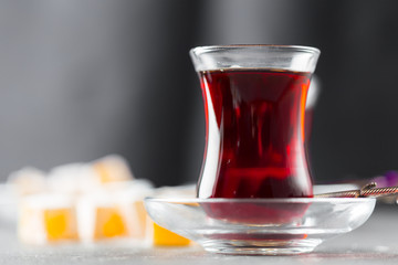 Red tea in turkish glasses on a wooden table