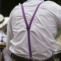 Rear view of a man wearing suspenders	