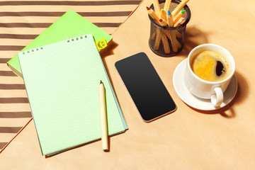Blank notepad and coffee cup