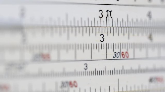 VINTAGE SLIDE RULE.  Old school calculating.  Macro shot in 4K.  Version 2 of 2.