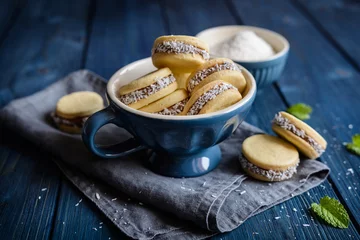 Foto auf Acrylglas Alfajore cookies filled with caramelized milk and coconut © noirchocolate