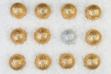Out of pattern sparkling balls on snow