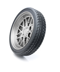 Car wheel tilted in motion against white background. Clipping path