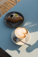 Breakfast at the beach with pasta and capuccino