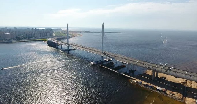 Aerial view at cable-stayed suspension bridge over Petrovsky fairway. WHSD viaduct above sea. St. Petersburg, Russia