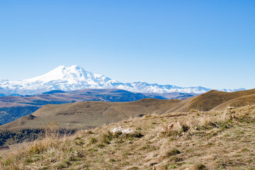 Landscape panorama Elbrus mountain with autumn hills