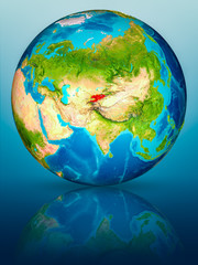 Kyrgyzstan on Earth on reflective surface