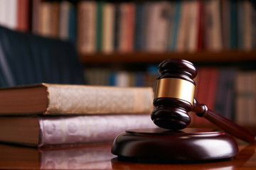 Judge gavel or law mallet on a wooden desk