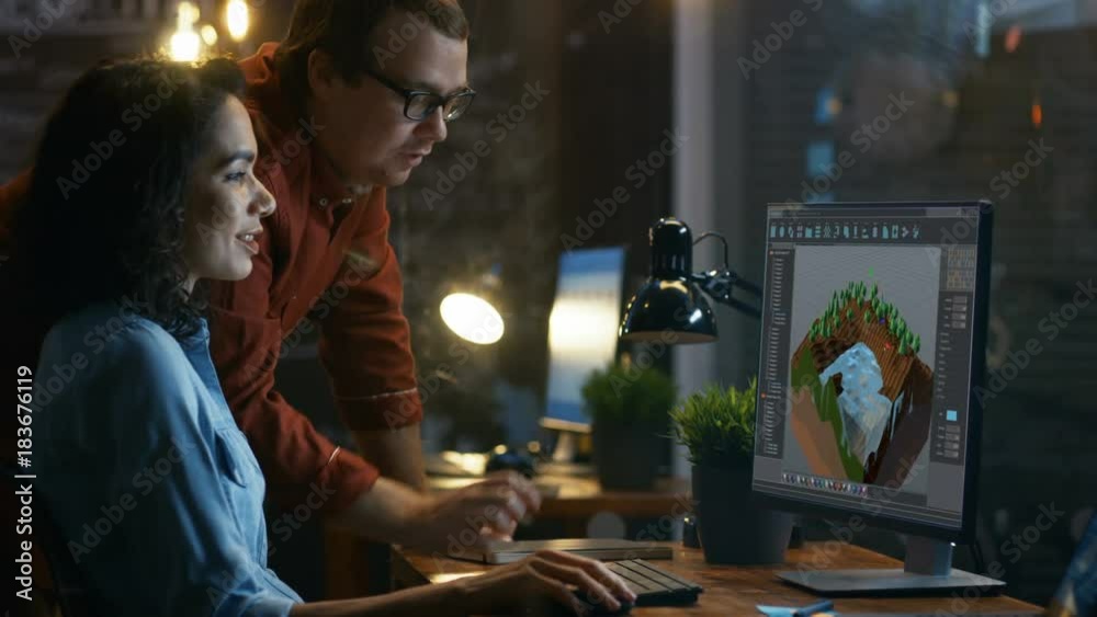 Poster Female 3D Video Game Developer Work on a Level Design on Her Computer and Talks with Project Manager. They Work in a Creative Office.