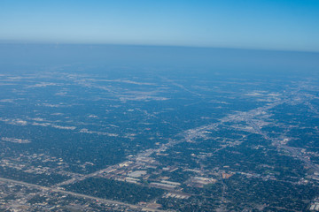 Fototapeta na wymiar Metropolis Area of Houston, Texas Suburbs from Above in an Airplane