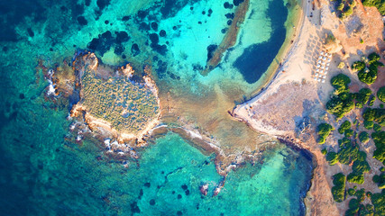 Autumn 2017: Aerial bird's eye view photo taken by drone depicting beautiful deep blue -  turquoise waters and rocky seascape