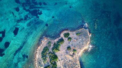 Fototapeta na wymiar Autumn 2017: Aerial bird's eye view photo taken by drone depicting beautiful deep blue - turquoise waters and rocky seascape